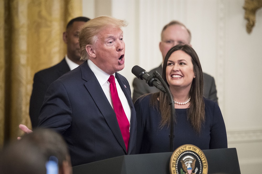 Sarah Huckabee Sanders and Donald Trump